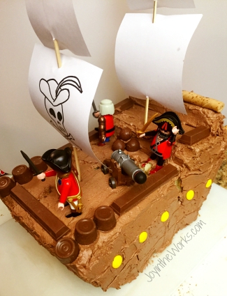 Pirate Ship Birthday Cake starts out with just a little crack that we thought we could hide with toothpicks and frosting