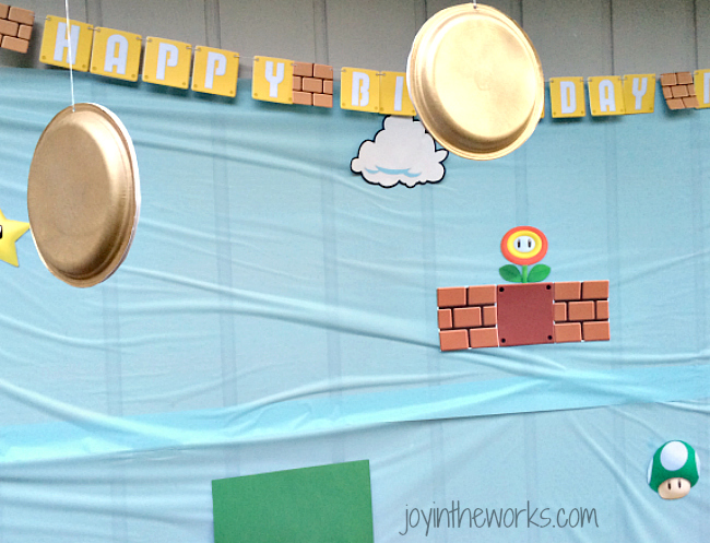 Find out how to make gold coins for the kids to jump up and hit for their Super Mario party game!