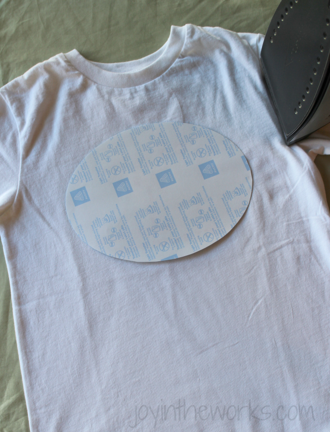 DIY iron-on 4th of July t-shirt, Step 5: Cut out design from transfer paper and lay face down on t-shirt. Iron on with hot, steam free iron.