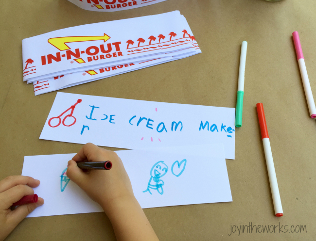 Step 4: Decorate the strips of paper for the outside of the soda jerk hat. We went with "ice cream maker" but I am sure there is some other more official sounding name!