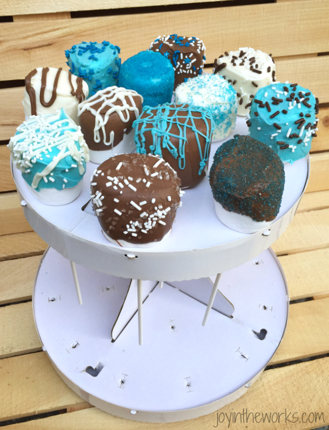 A variety of decorated marshmallow pops, perfect for baby shower favors