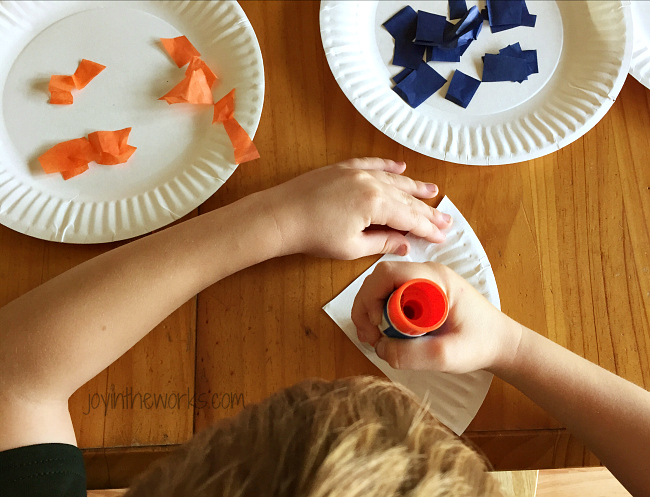 Step 5 of Thanksgiving Pie Garland for Kids: Put glue on paper plate triangle.