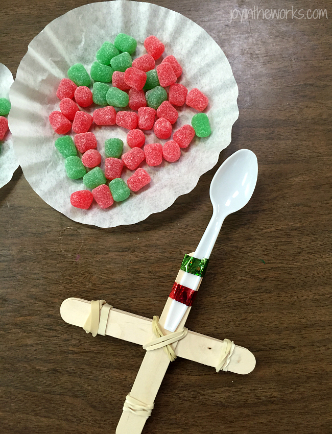 Fun #ChristmasSTEM Experiment: Make a gumdrop catapult and compare to mini marshmallows to see which one goes the farthest! #STEM