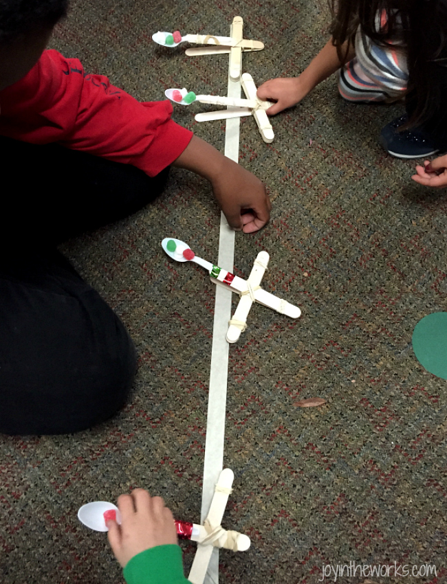 #ChristmasSTEM Activity: Comparing which object goes farther by catapult: mini marshmallows or gumdrops