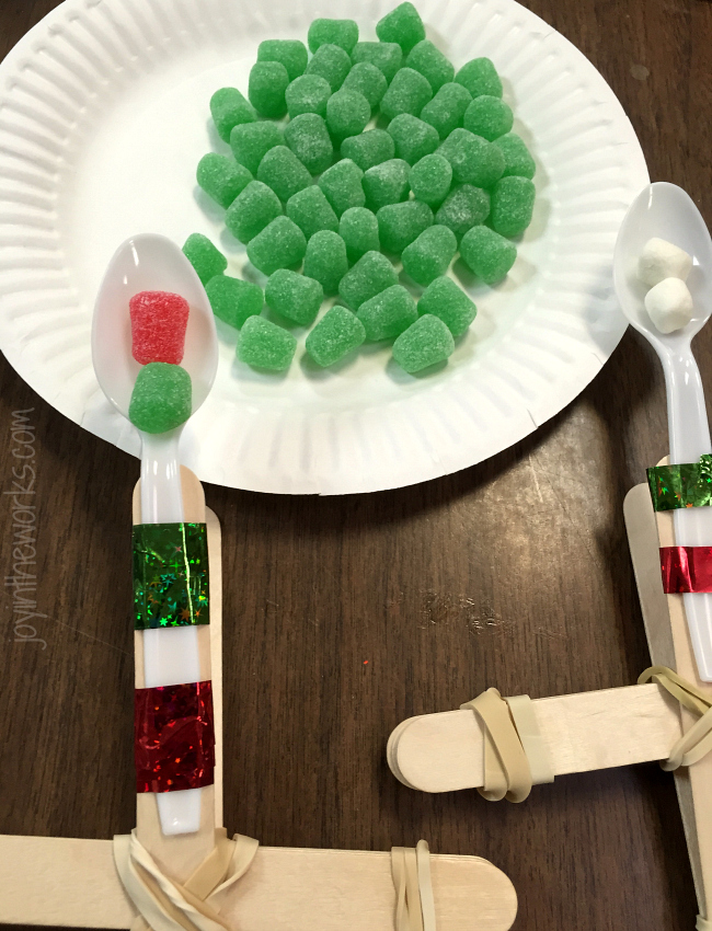 Fun #ChristmasSTEM Experiment: Make a gumdrop catapult and compare to mini marshmallows to see which one goes the farthest! #STEM