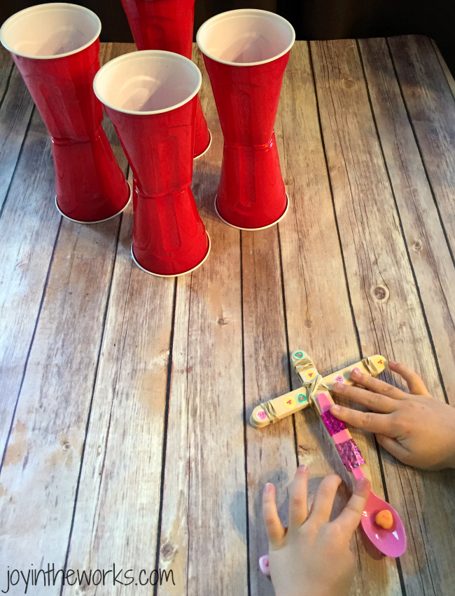 After you make your catapults, have a little fun and add some targets to try and catch those conversation hearts! #STEM Valentine Class Party Activity