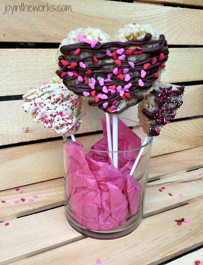 Chocolate Drizzled Heart Rice Krispie Treat Pops are so easy to make and are the perfect Valentine treat for the kids (and for the rest of us!!)!