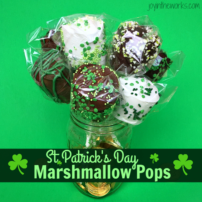 Easy DIY St. Patrick's Day Marshmallow Pops dipped in chocolate with festive green sprinkles