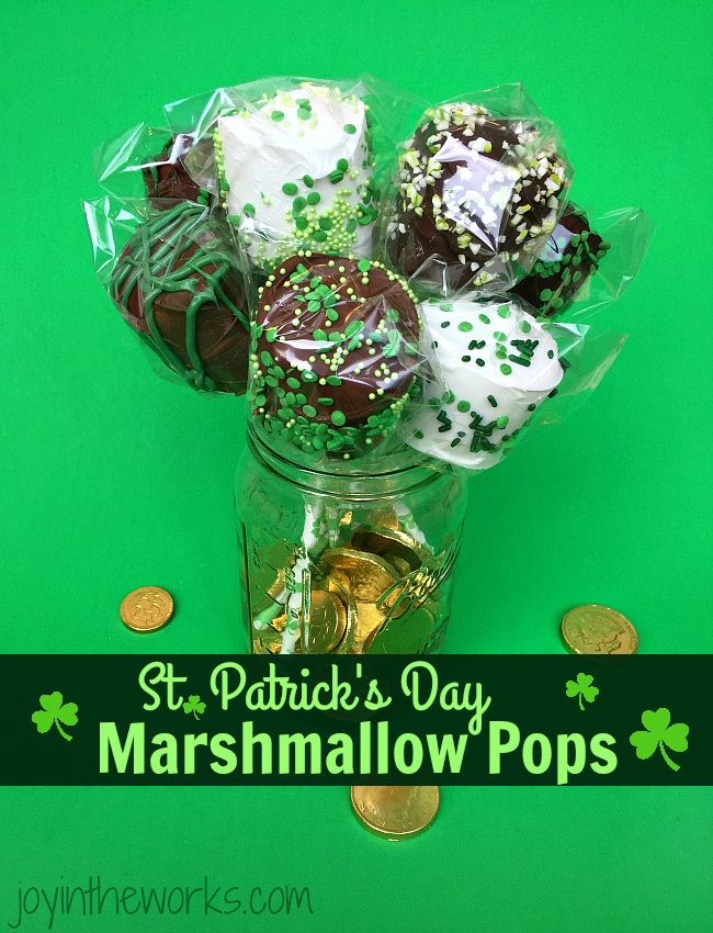 Easy DIY St. Patrick's Day Marshmallow Pops dipped in chocolate with festive green sprinkles