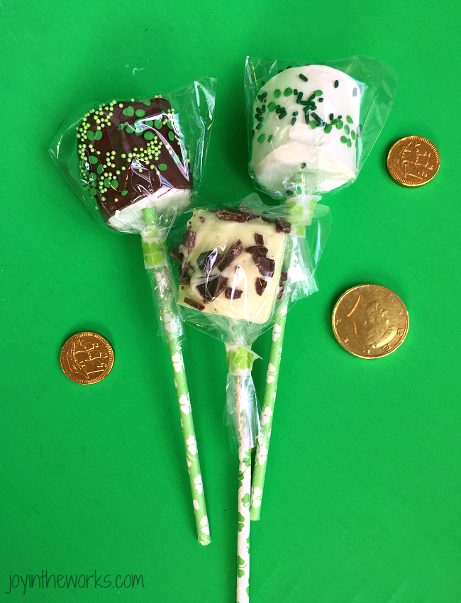 Easy DIY St. Patrick's Day Marshmallow Pops dipped in chocolate with festive green sprinkles