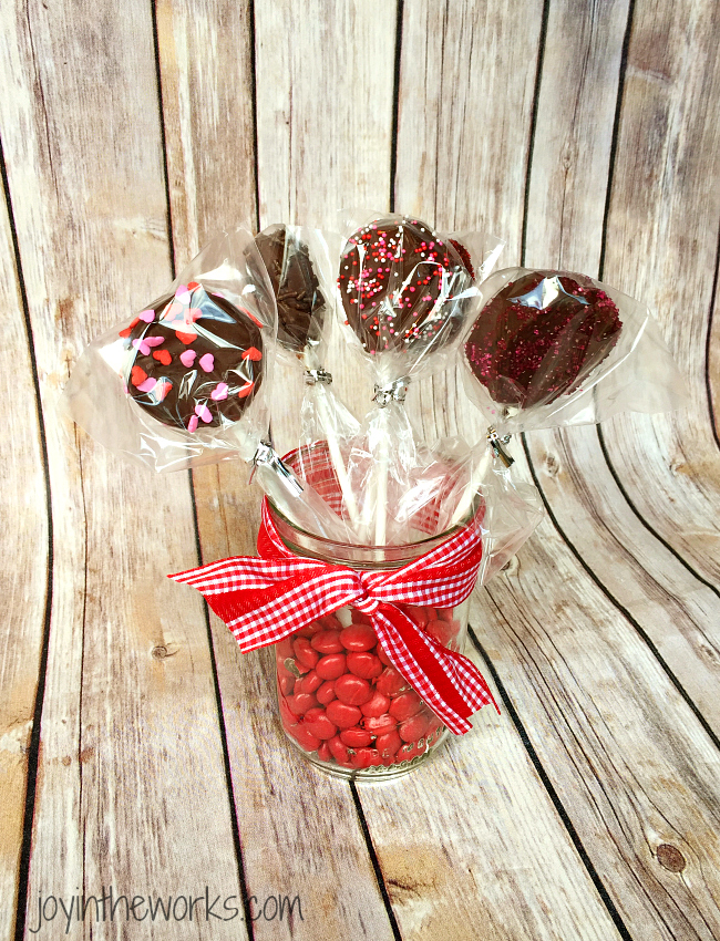 There is no better combination for Valentine's Day than strawberries and chocolate and these Valentine Oreo Pops using Chocolate Strawberry Oreos are an easy way to enjoy these flavors in a decadent Valentine's Day treat!