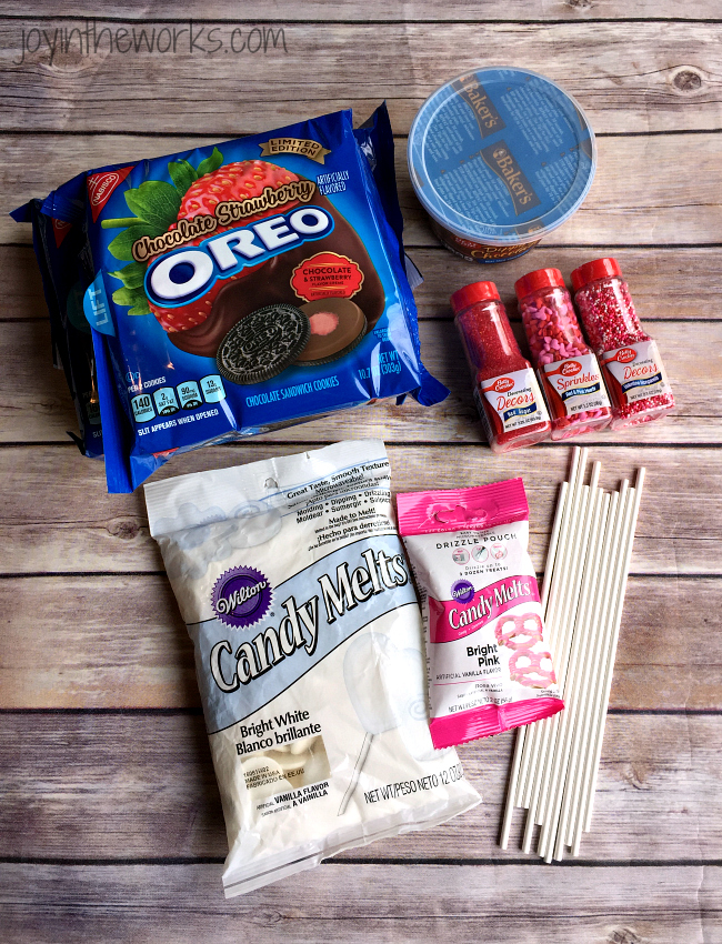 There is no better combination for Valentine's Day than strawberries and chocolate and these Valentine Oreo Pops using Chocolate Strawberry Oreos are an easy way to enjoy these flavors in a decadent Valentine's Day treat!