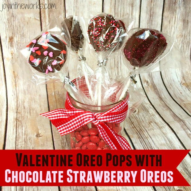 There is no better combination for Valentine's Day than strawberries and chocolate and these Valentine Oreo Pops using Chocolate Strawberry Oreos are an easy way to enjoy these flavors in a decadent Valentine's Day treat!