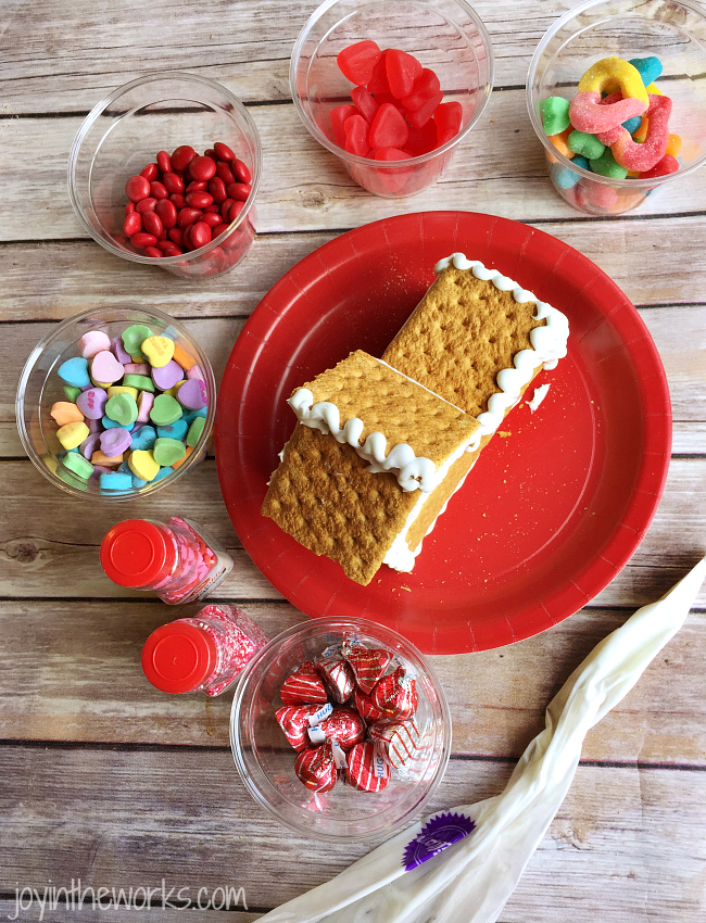 Gingerbread houses aren't just for Christmas! Why not take advantage of all the Valentine's Day candy and make a Valentine Candy House? So easy to make and so fun for the kids! A Valentine Gingerbread House would make a great Valentine's Day class party activity too!