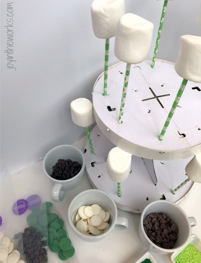 Easy DIY St. Patrick's Day Marshmallow Pops dipped in chocolate with festive green sprinkles