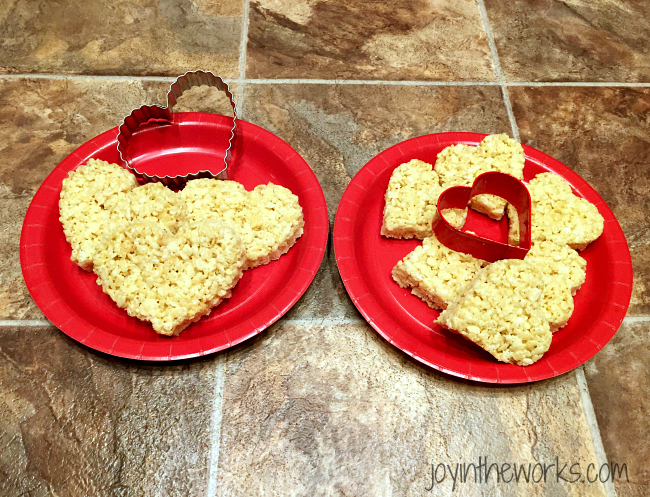 Use heart cookie cutters to cut out your heart rice krispie treats for your heart rice krispie treat pops.
