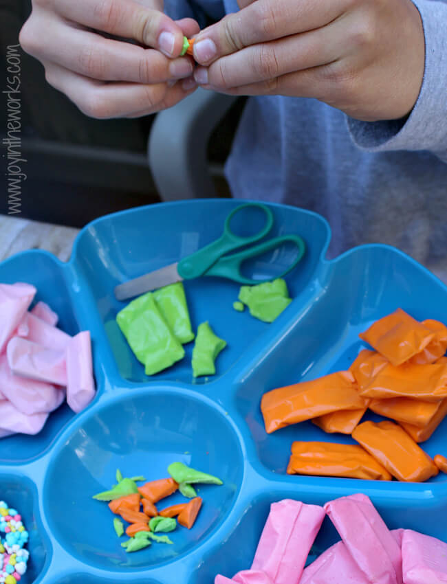 When making your springtime candy farm with graham cracker barn, you can use Laffy Taffy to make carrots for your garden! #SpringItOn #NestleKitchen #CollectiveBias
