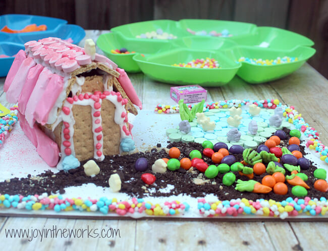 Looking for a spring family fun activity that everyone will enjoy? Make this Springtime Farm with a graham cracker barn and candy garden and pond. Decorate the roof with SweeTARTS, the garden with RUNTS, a Fun Dip Fence and SweeTARTS farm animals. Everyone will love making it (and probably eating a bit too!) #SpringItOn #NestleKitchen #CollectiveBias