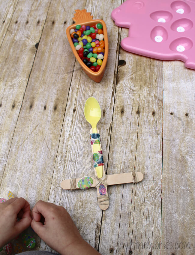 Looking for a fun Spring or Easter activity for an Easter Party or just a fun activity at home? Check out this Jelly Bean Catapult activity where the kids build their own catapults and launch the classic Easter candy! To make it extra fun, add point values and target practice! It's a great #STEM activity that ends with sweets!