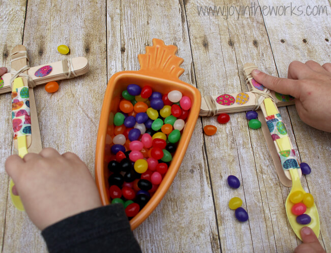 Looking for a fun Spring or Easter activity for an Easter Party or just a fun activity at home? Check out this Jelly Bean Catapult activity where the kids build their own catapults and launch the classic Easter candy! To make it extra fun, add point values and target practice! It's a great #STEM activity that ends with sweets!