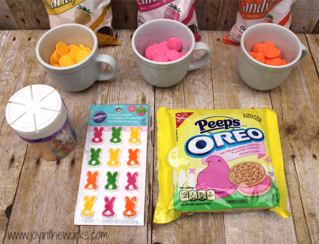 Did you know they make Peeps Oreos now?! I decided to make them even better by dipping them in candy and adding some festive Easter sprinkles! They were so fun to make and they tasted delicious too! A perfect Easter treat!