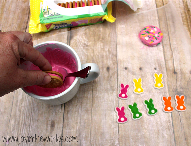 Did you know they make Peeps Oreos now?! I decided to make them even better by dipping them in candy and adding some festive Easter sprinkles! They were so fun to make and they tasted delicious too! A perfect Easter treat!