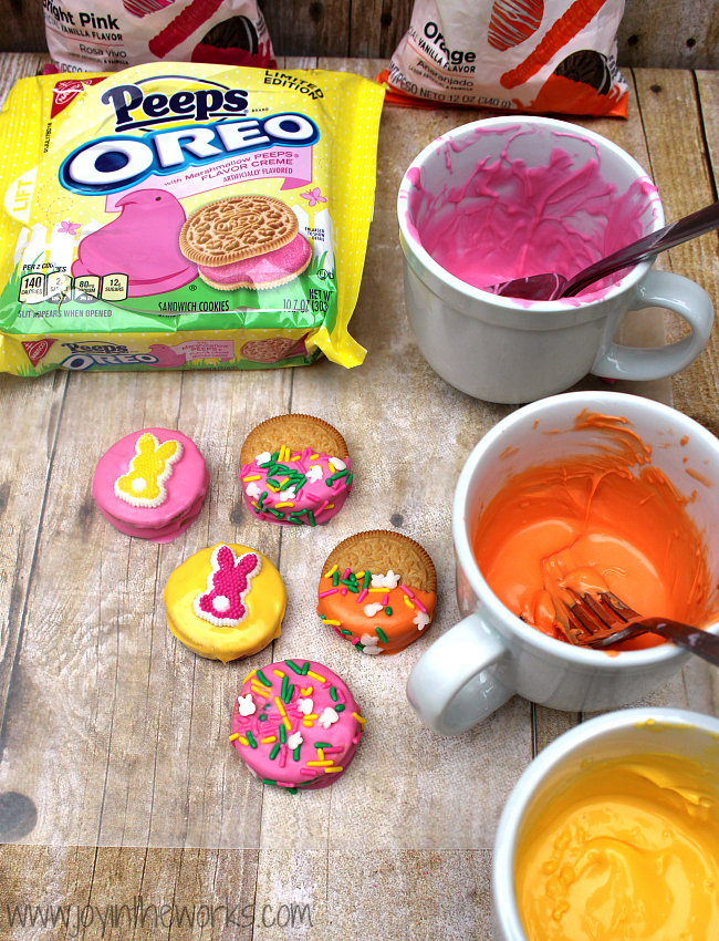 Did you know they make Peeps Oreos now?! I decided to make them even better by dipping them in candy and adding some festive Easter sprinkles! They were so fun to make and they tasted delicious too! A perfect Easter treat!