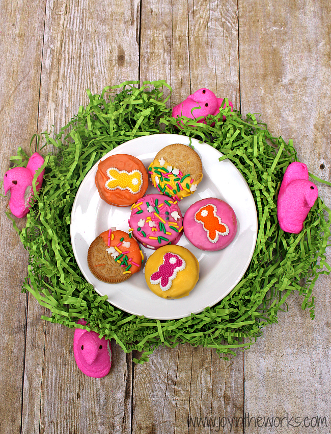 Did you know they make Peeps Oreos now?! I decided to make them even better by dipping them in candy and adding some festive Easter sprinkles! They were so fun to make and they tasted delicious too! A perfect Easter treat!