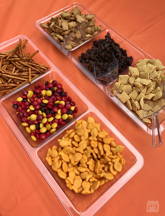 A (mostly) healthy Fall Snack Mix for kids with Goldfish Crackers, pretzels, raisins, cereal, Teddy Grahams and a small sweet treat with Fall M&M's