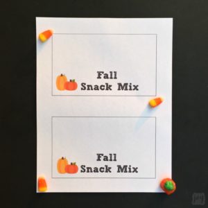 A Fall Snack Mix Treat Bag Topper is perfect for taking home snacks after a Halloween Party or Fall Festival! Even better? Have kids create their own Fall Snack Mix with my printable follow-along directions!