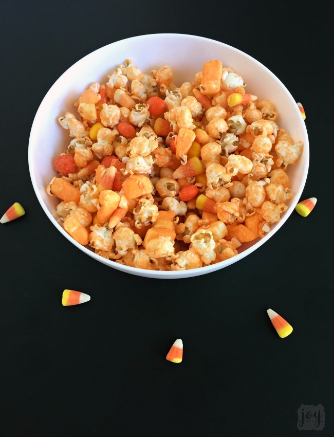 Whether you call it Candy Corn Trail Mix, Candy Corn Popcorn Mix or Candy Corn Snack Mix, this is the perfect Fall Snack for a Halloween Party or addition to a Boo Kit! Even better? It comes with a free printable Candy Corn Themed Halloween gift tag!