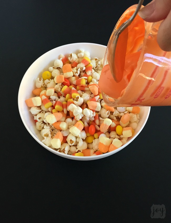 Whether you call it Candy Corn Trail Mix, Candy Corn Popcorn Mix or Candy Corn Snack Mix, this is the perfect Fall Snack for a Halloween Party or addition to a Boo Kit! Even better? It comes with a free printable Candy Corn Themed Halloween gift tag!