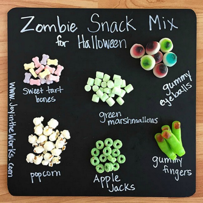 Throwing a Halloween party for kids? Looking for a creative Halloween themed snack? This Zombie Snack Mix for kids is the perfect Halloween party food with its gummy fingers, eyeballs and bones! For an extra special touch, add a green candy coating and green snack foods in green zombie cups for a true Zombie theme! #HalloweenPartyFood #ZombieSnackMix