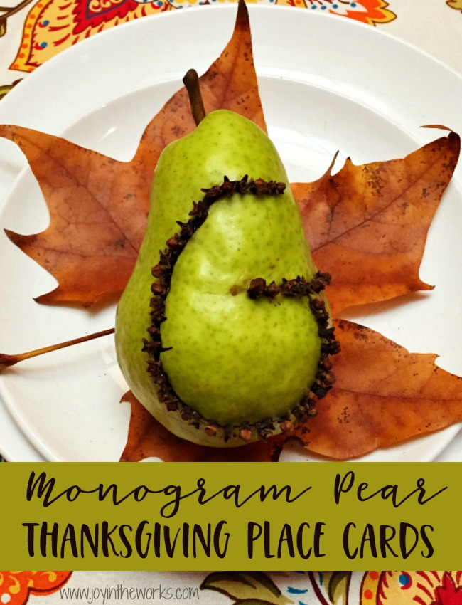 Beautiful kid made Thanksgiving Placecards! This Monogram Pear Thanksgiving Placecard made with cloves can be made by an adult or an older child and is such a beautiful addition to your Thanksgiving table! #thanksgivingtable #thanksgivingplacecards #diythanksgiving #thanksgivingcraft