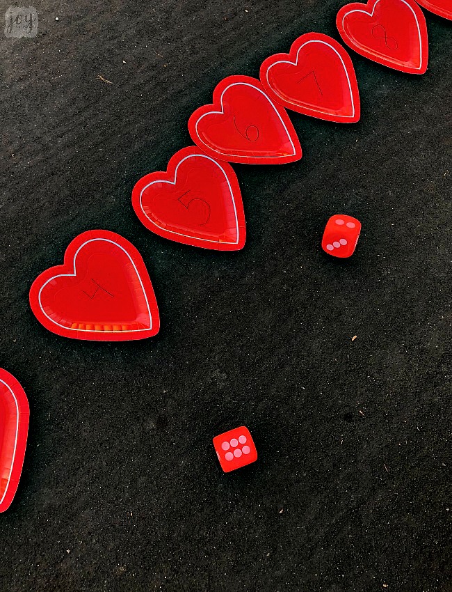 Practice addition, counting, subitizing and more with these simple Valentine themed math games using heart shaped paper plates! #valentinesday #mathgames #addition #subtraction #counting #math #handsonlearning