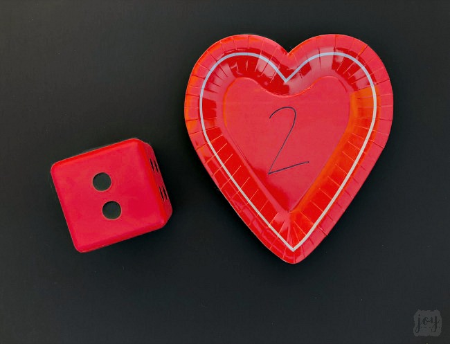 Practice addition, counting, subitizing and more with these simple Valentine themed math games using heart shaped paper plates! #valentinesday #mathgames #addition #subtraction #counting #math #handsonlearning