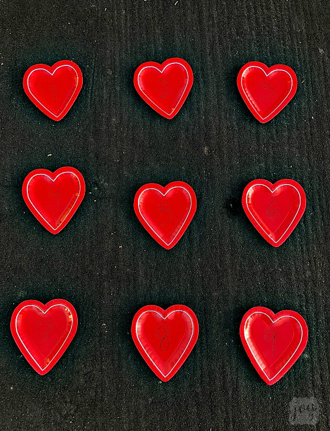 Practice addition, counting, subitizing and more with these simple Valentine themed math games using heart shaped paper plates! #valentinesday #mathgames #addition #subtraction #counting #math #handsonlearning