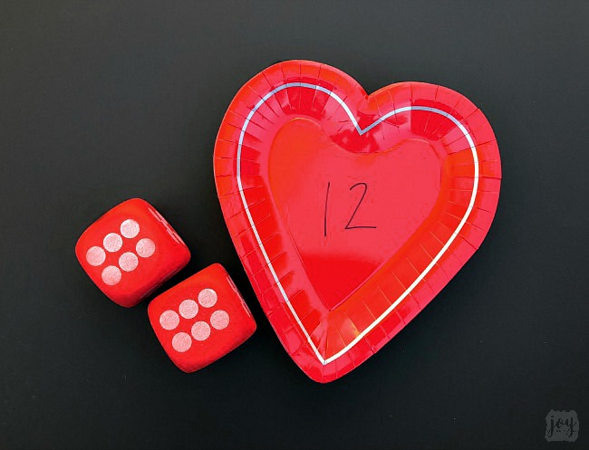 Practice addition, counting, subitizing and more with these simple Valentine themed math games using heart shaped paper plates! #valentinesday #mathgames #addition #subtraction #counting #math #handsonlearning