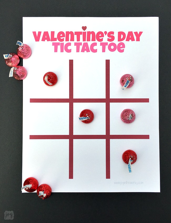 Need a quick and easy printable Valentine's Day Party Game? Valentine Themed Tic Tac Toe is always a hit, especially when you pair it with chocolate kisses or candy hearts! Download the free printable Valentine's Day game complete with game pieces or get inspired by the numerous creative game piece ideas! #valentinesdayparty #valentinesdaypartygames #kidgames #printablegame #freeprintable #tictactoe