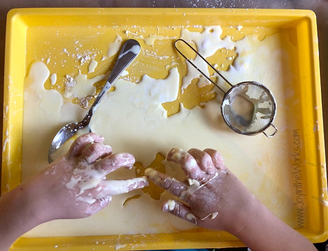 Kids can make Oobleck (Also called Goop!) out of cornstarch and water for messy, sensory play! Oobleck is just one of 30 Activity Cards included in the Summer Box! The Summer Box is the answer for bored kids as it guides them with simple instructions on 30 different activity cards and a box full of the corresponding supplies. Kids can create, experiment and play their way through the entire summer and it only take one day of prep for you!