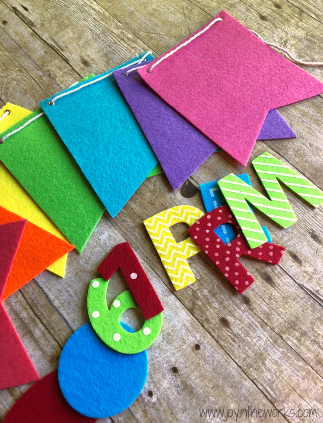 Make your own DIY Felt Banner with rainbow felt and interchangeable velcro letters so that you can use it for every holiday and special occasion!